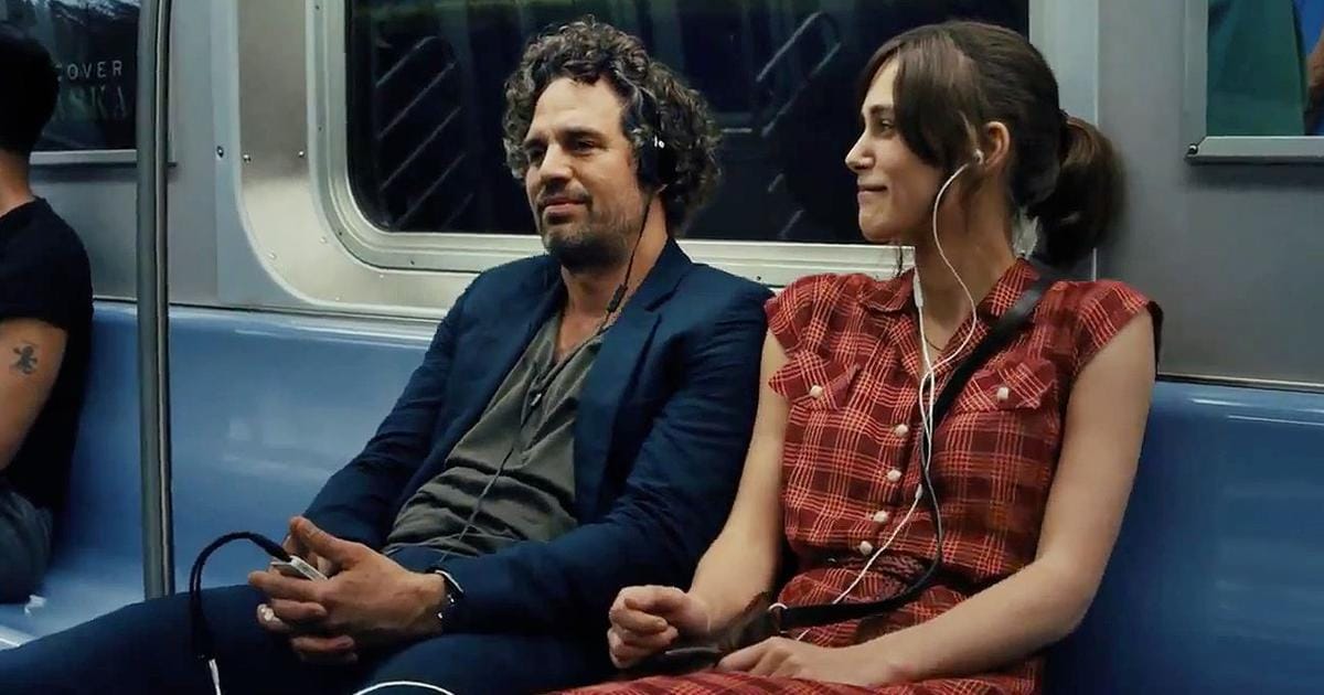 Dan Mulligan (Mark Ruffalo) sits next to Gretta James (Kiera Knightley) on the subway in Begin Again