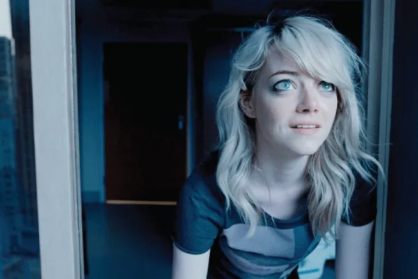 Sam (Emma Stone) looks at something out a window in Birdman