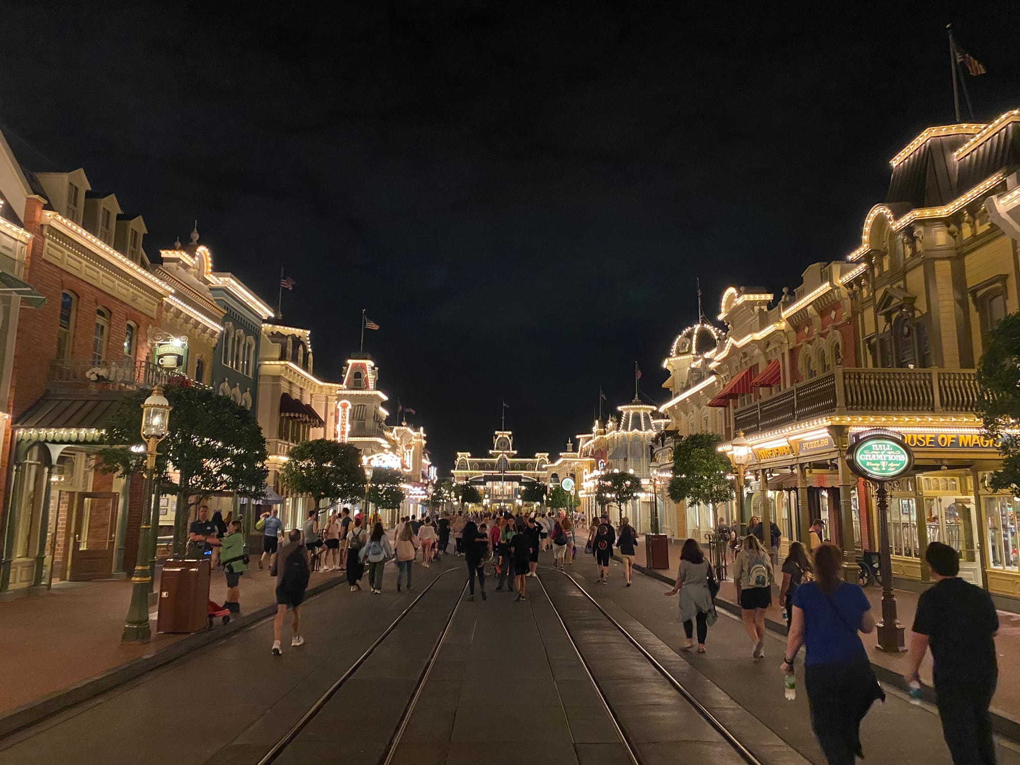 Main Street USA at Magic Kingdom in Disney World. Its nighttime and the camera is pointed towards the train station.