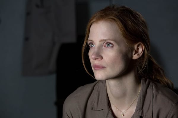 Murph (Jessica Chastain) watches something with tears in her eyes in  scene from Interstellar